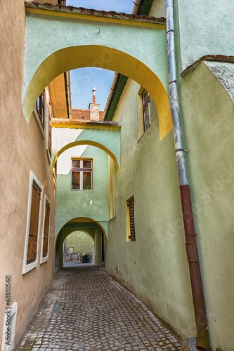 Ancient alley with arches i...