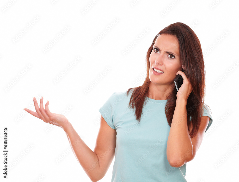 Angry hispanic woman speaking on her phone Angry hispanic woman speaking on her phone