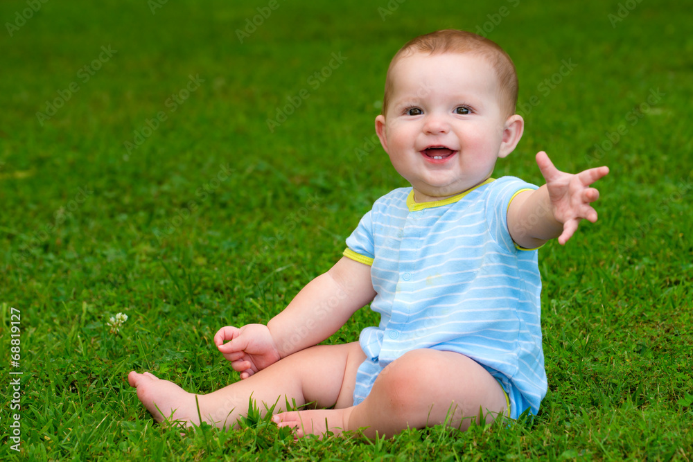 Summer portrait of happy baby boy infant outdoors at park Summer portrait of happy baby boy infant outdoors at park