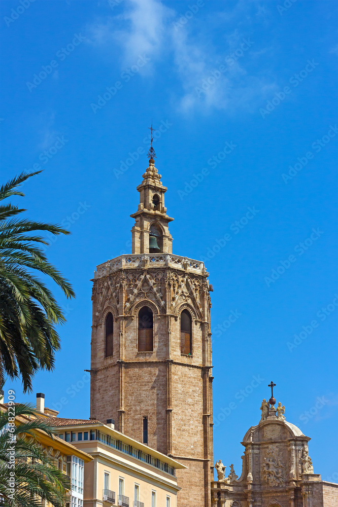 Valencia Cathedral Bell Tower and palm trees.