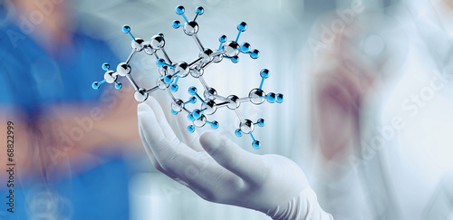 Tela scientist doctor hand holds virtual molecular structure in the l