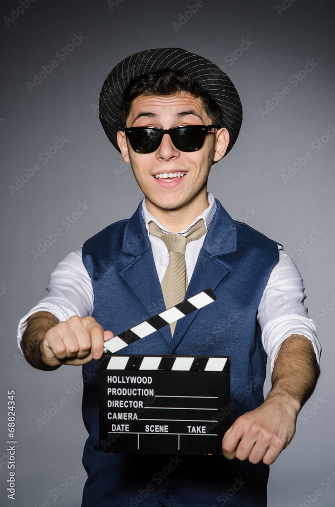 Funny man with movie clapper Funny man with movie clapper