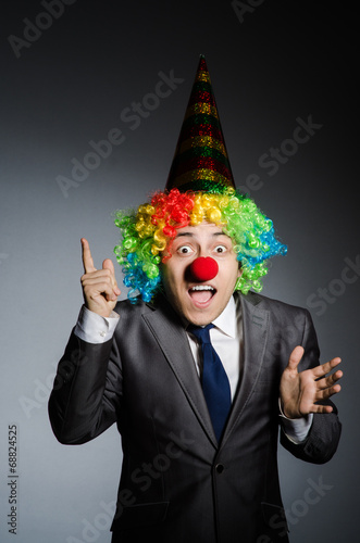 Clown businessman in funny concept