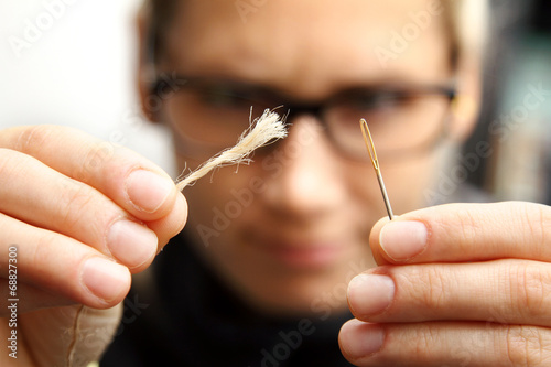 concept of persistence - needle and thread photo