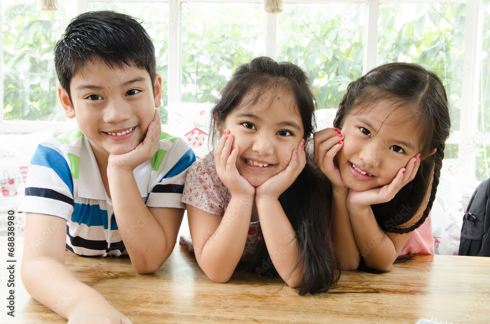 portrait of happy asian boy and girl having fun