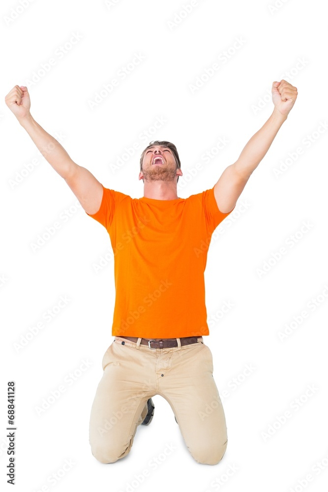 Excited man in orange cheering Excited man in orange cheering
