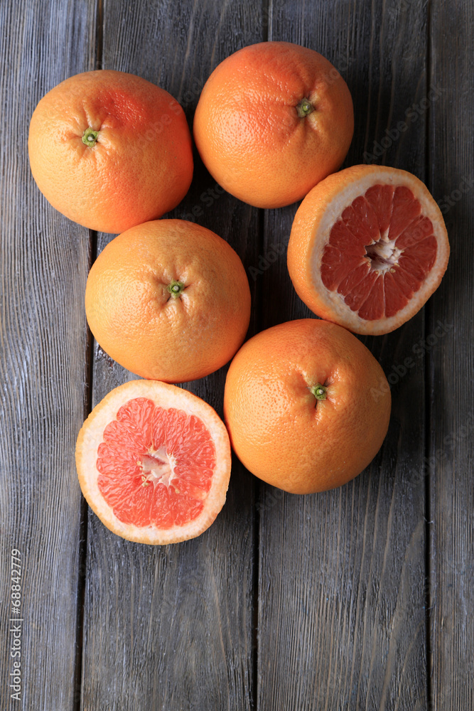 Ripe grapefruits on wooden background Ripe grapefruits on wooden background