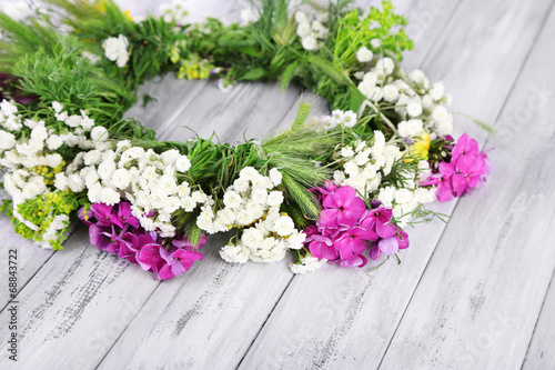 Wildflower wreath on grey wooden background