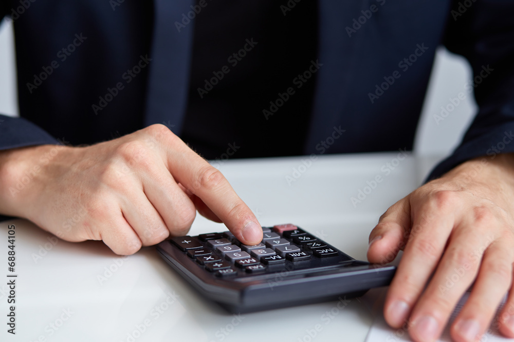 Men's hands with calculator Men's hands with calculator