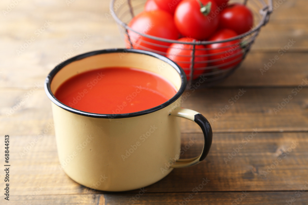 Homemade tomato juice in color mug and fresh tomatoes Homemade tomato juice in color mug and fresh tomatoes
