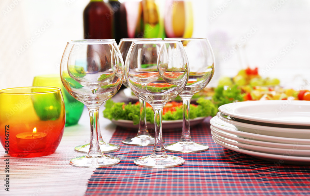 Buffet table with dishware waiting for guests Buffet table with dishware waiting for guests