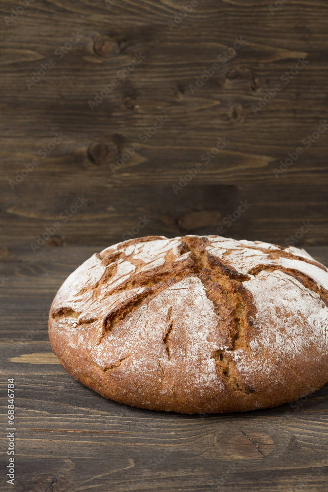 Rye bread on wooden background