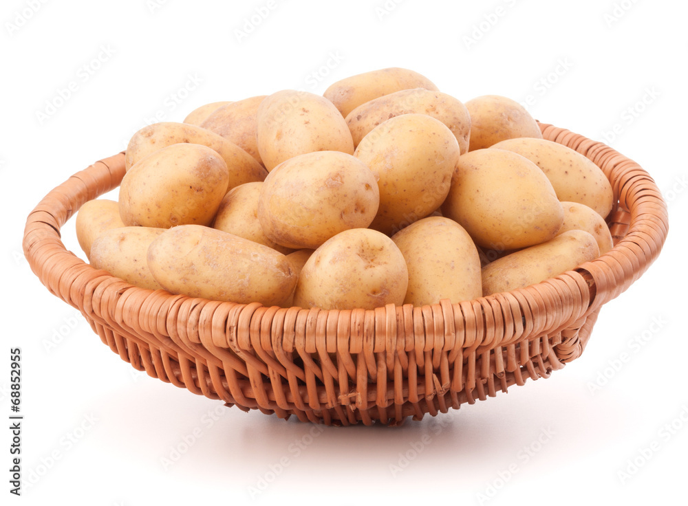 Potato tuber in wicker basket isolated on white background Potato tuber in wicker basket isolated on white background