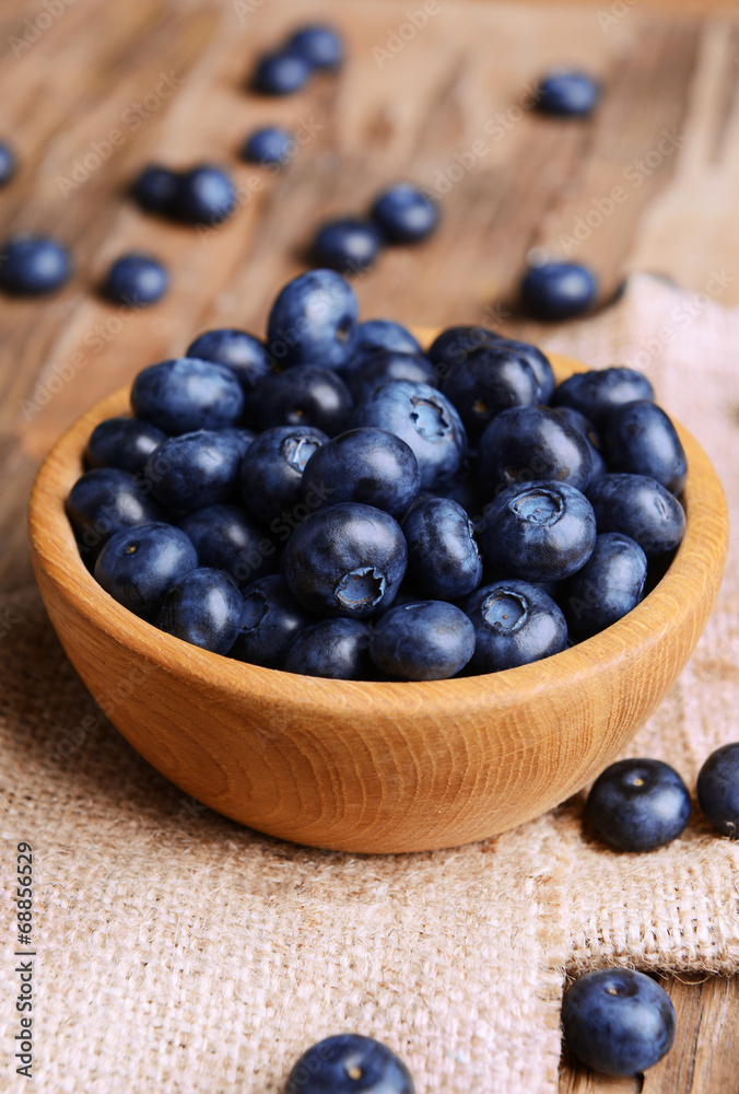 Delicious blueberries in bowl on table close-up Delicious blueberries in bowl on table close-up
