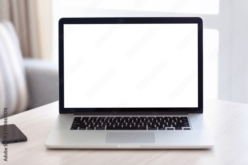 laptop with isolated screen is on the table in the room laptop with isolated screen is on the table in the room