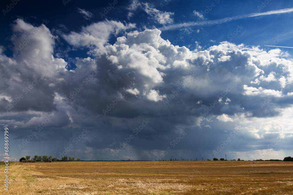 Thundercloud over a cropped field