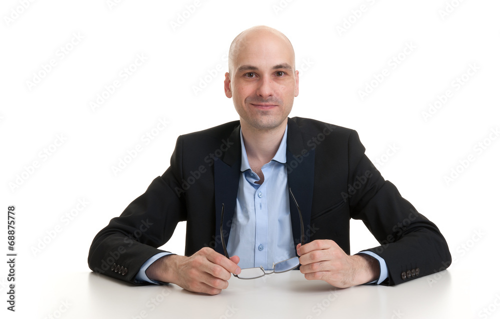 cheerful businessman sitting at a table