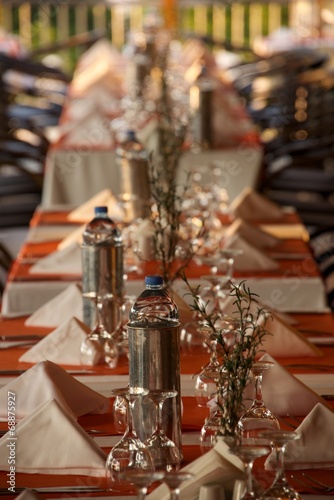 Restaurant table laid with glassware and cutlery