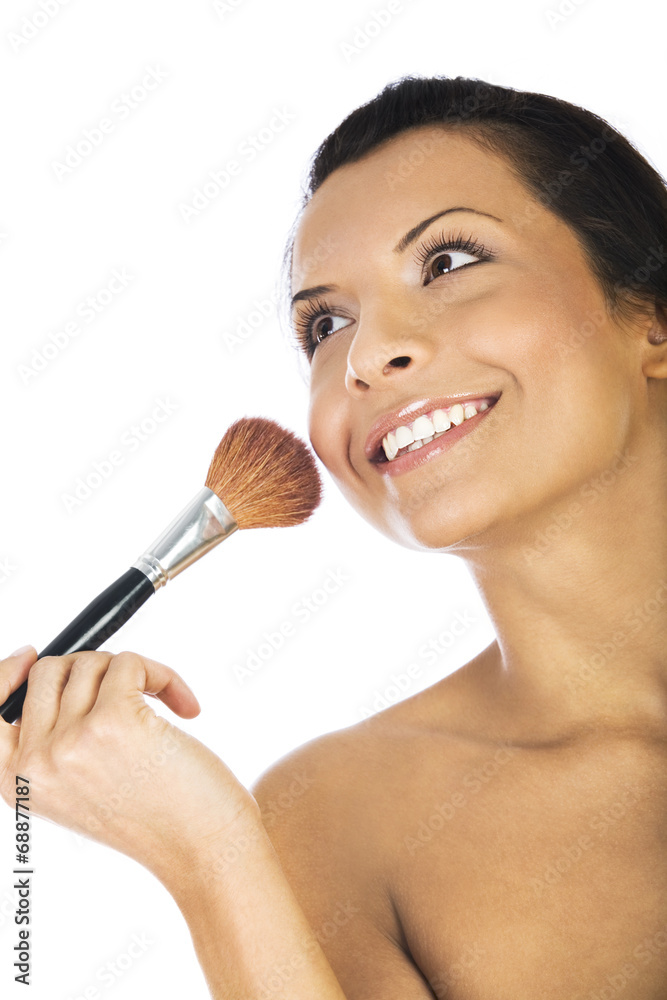 Beautiful woman applying blush with makeup brush on white Beautiful woman applying blush with makeup brush on white