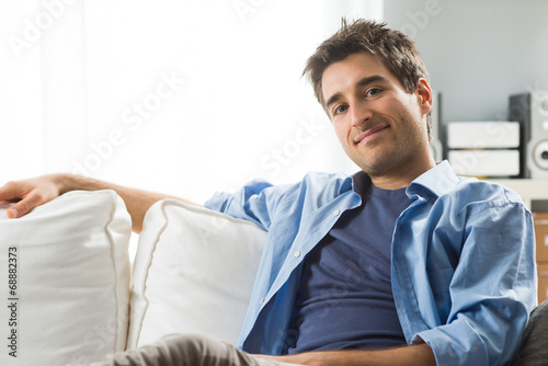 Young man relaxing on sofa