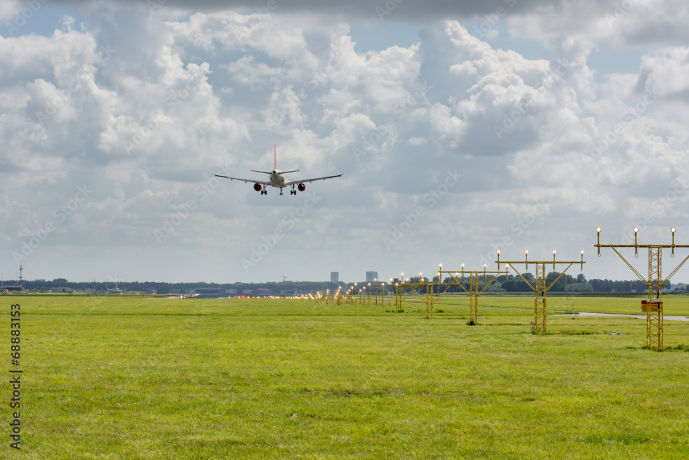 Fototapeta premium unidentified plane on landing approach at amsterdam airport