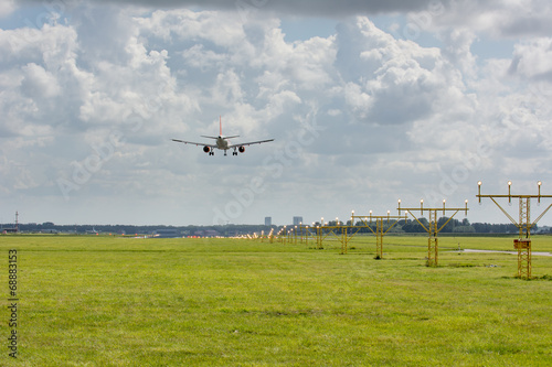 unidentified plane on landing approach at amsterdam airport