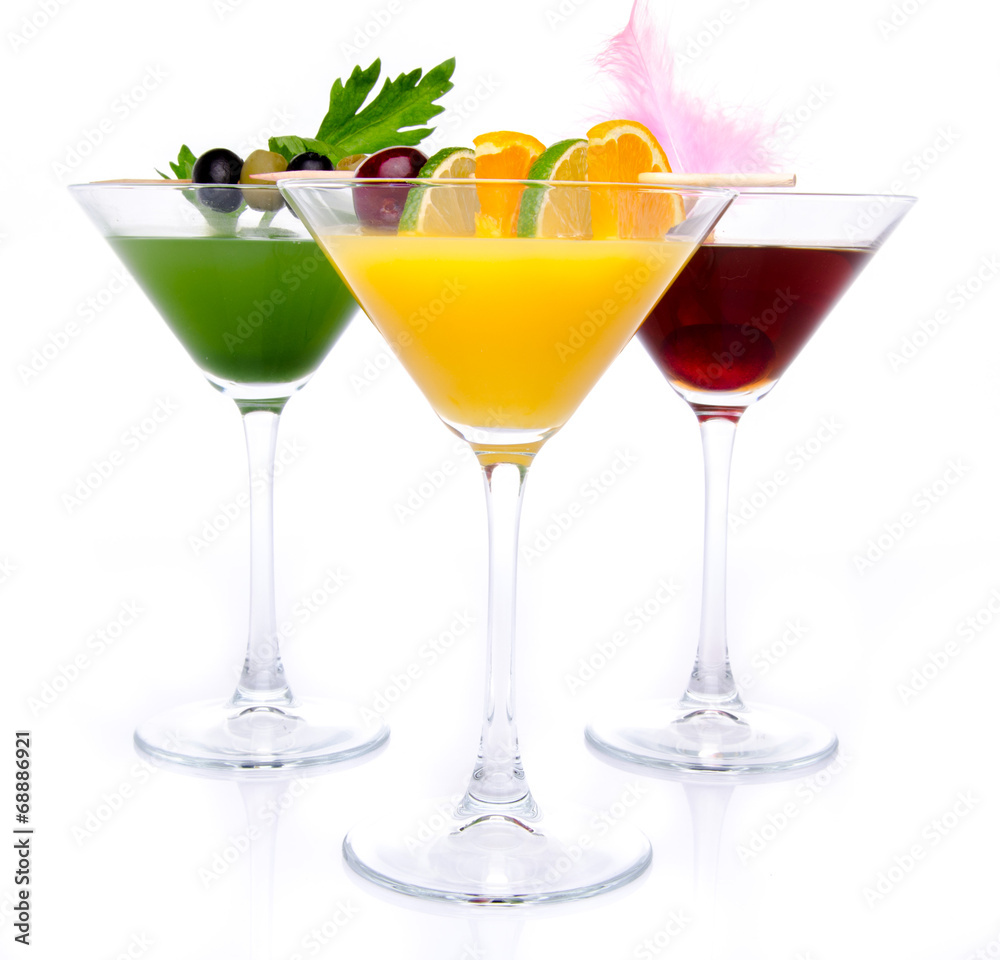 Composition with a orange, cherry and green vegetables cocktails