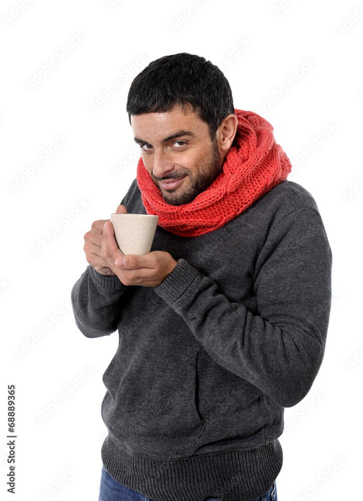 attractive man drinking cup of hot coffee feeling winter cold