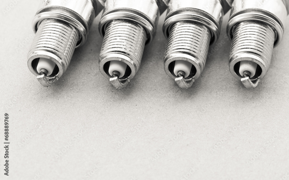 Auto service. Set of spark plugs as spare part of car. Auto service. Set of spark plugs as spare part of car.
