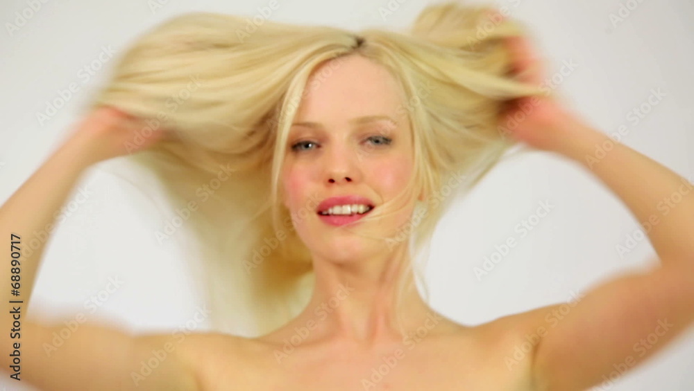 Gorgeous sexy woman showing shiny healthy hair, studio Gorgeous sexy woman showing shiny healthy hair, studio