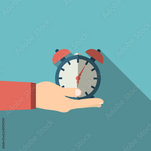 Hand holding alarm clock in flat design on background