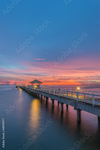 Landscape of Wooded bridge in the port between sunrise © weerasak
