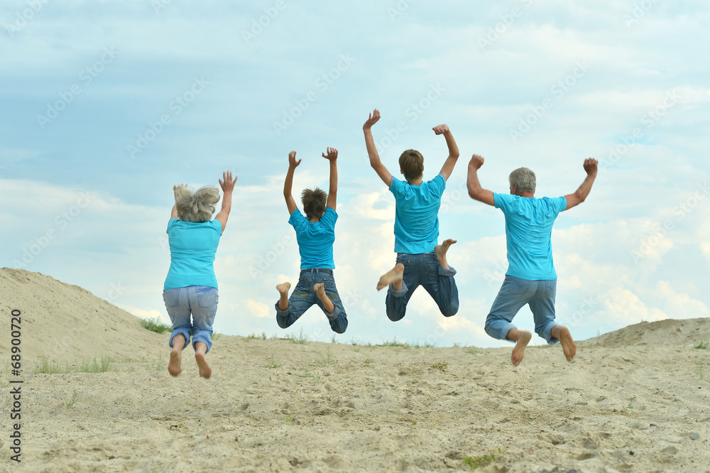 Grandparents with grandchildren jumping Grandparents with grandchildren jumping