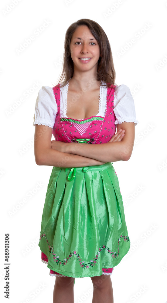 Stehende Frau im Dirndl mit verschränkten Armen Stehende Frau im Dirndl mit verschränkten Armen
