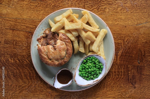 steak and mushroom pie with chips and peas