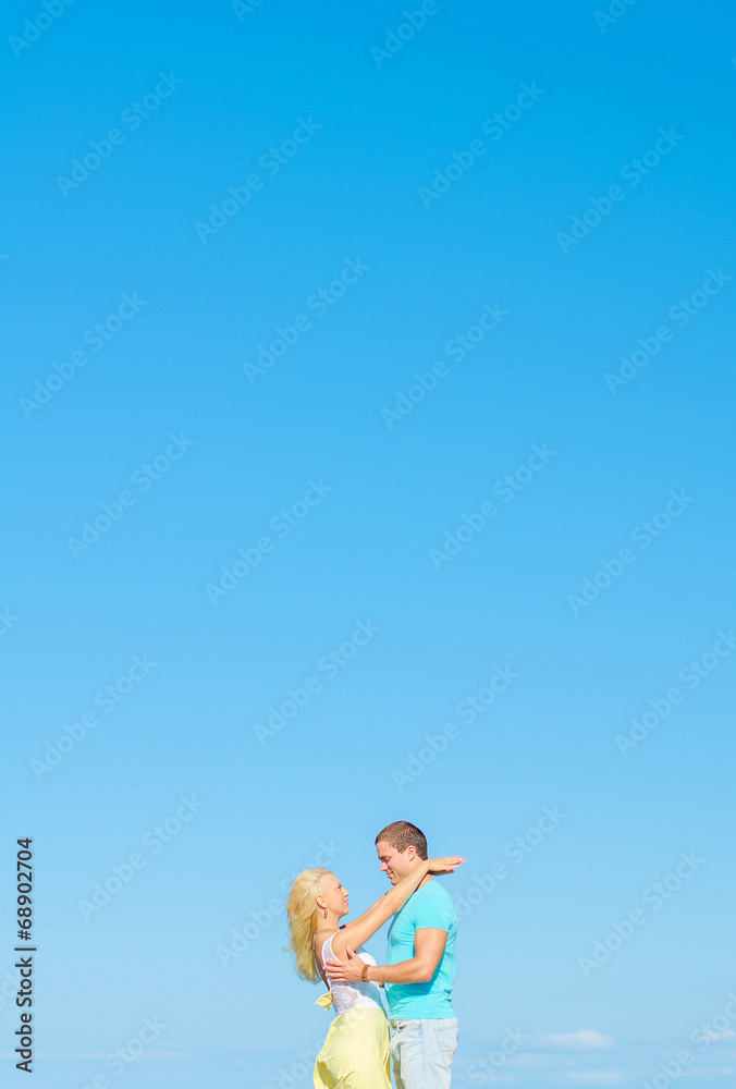 Picture of romantic young couple. Space for text.