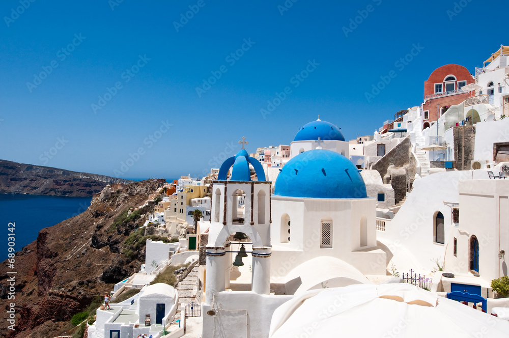 Oia church with blue domes and the bell. Santorini, Greece