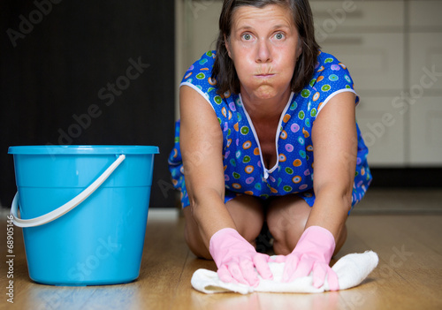 woman scrubbing the floor