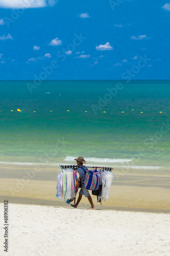Salesman walking on the beach..