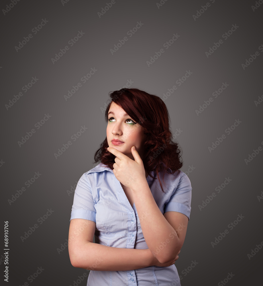 Young woman thinking with copy space Young woman thinking with copy space