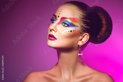 Horizotnal portrait of attractive woman with multicolor make up