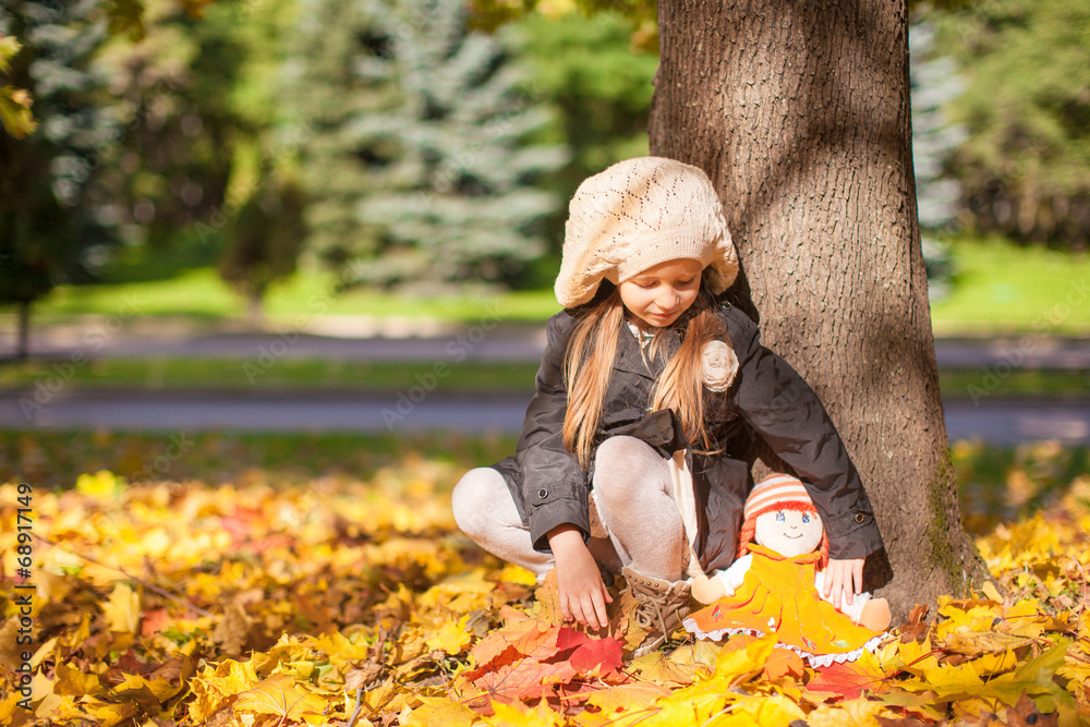 Cute little girl at warm sunny autumn day outdoor Cute little girl at warm sunny autumn day outdoor