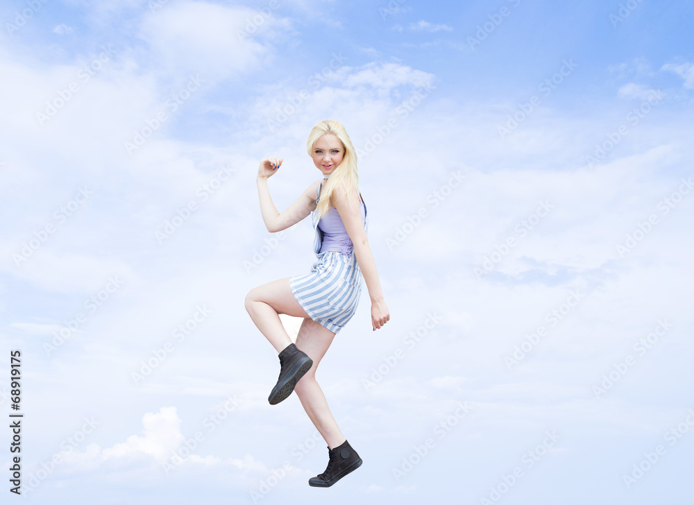dancing girl on a background of blue sky dancing girl on a background of blue sky