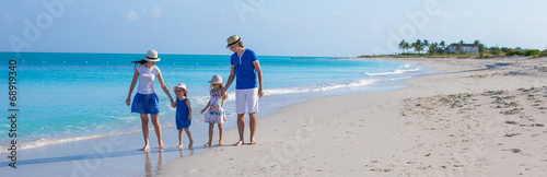 Photography Happy family with two girls on summer vacation