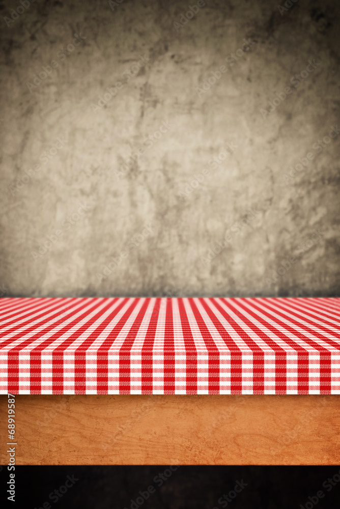 Table cloth, kitchen napkin on wooden background.