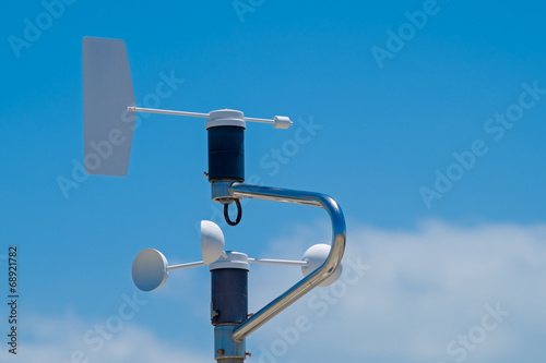 Anemometer, blue sky with clouds as background
