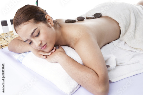 Massage Stones On Woman s Back At Spa
