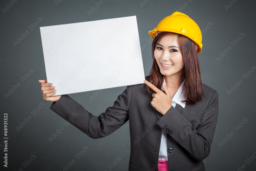 Asian engineer girl point to a blank sign Asian engineer girl point to a blank sign