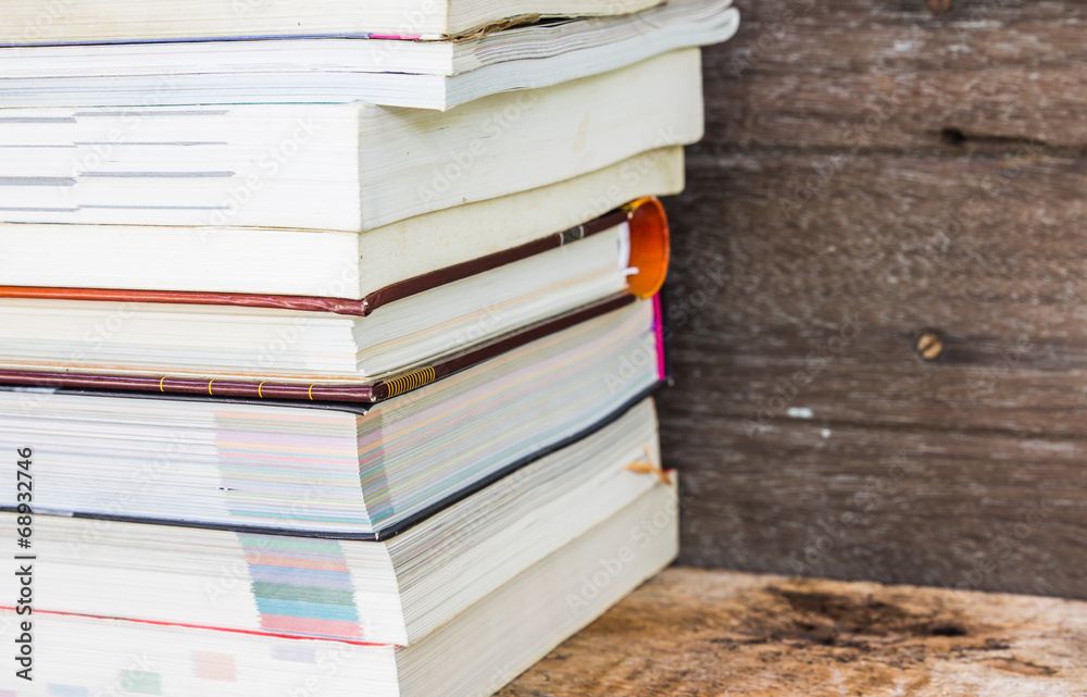 Old books on a wooden shelf. No labels, blank spine. Old books on a wooden shelf. No labels, blank spine.