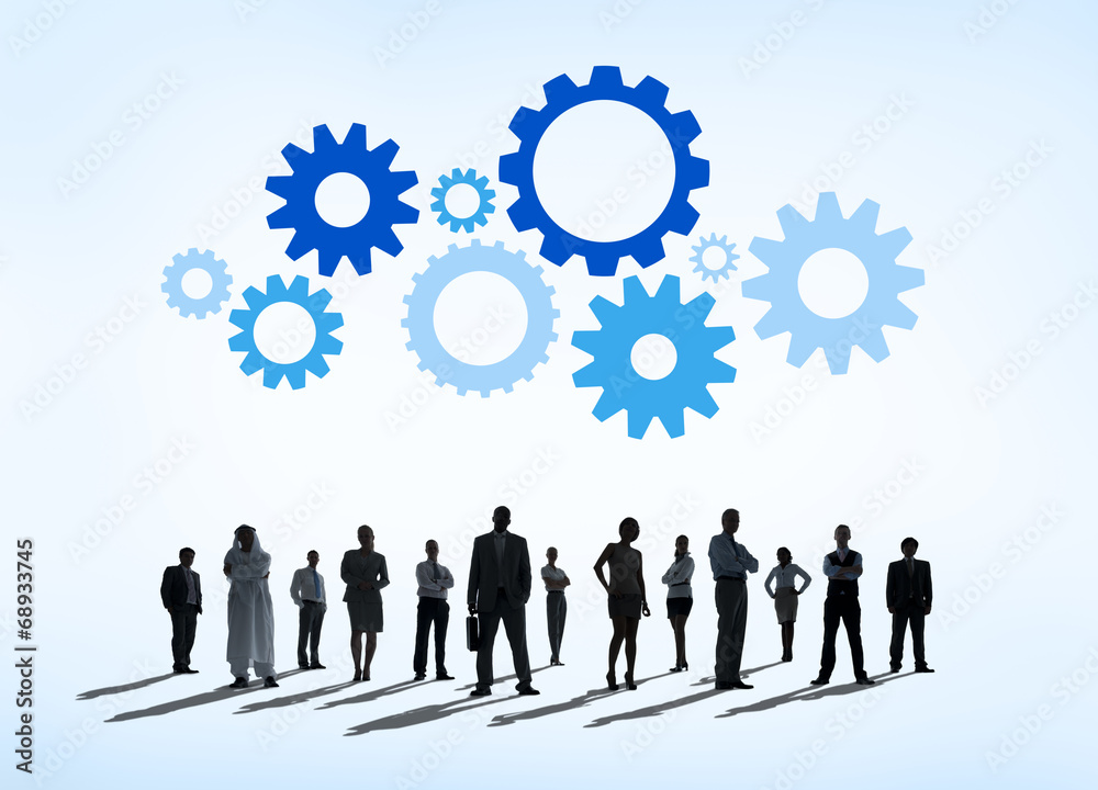 Silhouettes of Business People and Gears Above